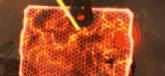 a person is standing in front of a large block of fire