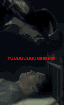 a picture of a man laying in a bed with the words " tuuuuuuuuuuuneeee " written in red