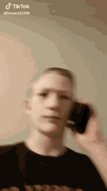 a blurry picture of a man talking on a phone