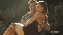 Carrying Armie Hammer GIF - Carrying Armie Hammer Lily James GIFs