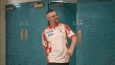 a man wearing a red and white shirt with the word bauer on it