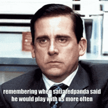 a man in a suit and tie has a sad look on his face