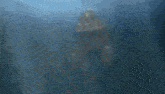 a blurred image of a boat floating in the ocean
