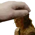 a person is putting a towel on another person 's head .