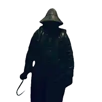 a man wearing a hat and a black coat holds a cane
