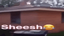 a brick building with a trash can in front of it and the word sheesh written on it .