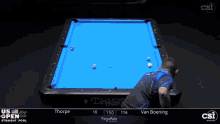a pool table with a blue cloth that says diamond
