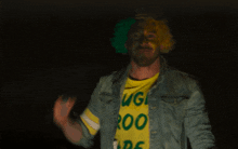 a blurry picture of a man wearing a yellow and green shirt that says ' igg ' on it