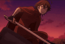 a man in a red cape is holding a sword in his hand