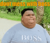 a very fat man wearing a boss shirt