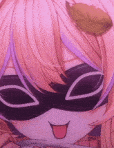 a close up of a girl wearing a mask with her tongue sticking out