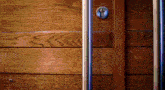 a wooden door with a metal handle and a keyhole