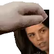 a hand is touching a woman 's forehead in a pixel art image .