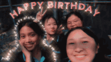 a group of young girls are posing for a picture with the words happy birthday written above them
