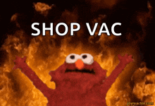elmo with his arms in the air and the words shop vac above him