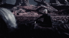 a blurred image of a person standing in a field