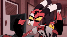a cartoon character is sitting in front of a computer monitor