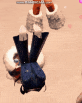 a person is upside down in a video game and the website bandicam.com is visible