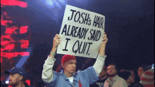 a man is holding up a sign that says josh 's hair already said i quit