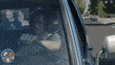 a man driving a car with the word rob at the bottom of the screen