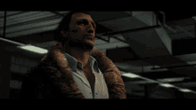 a man in a fur coat is looking down at something