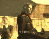 a man in a uniform says he 's good while standing next to a woman