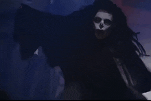 a painting of a woman with a skeleton face