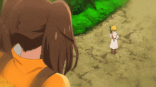 a girl in a yellow jacket stands next to a boy in a white coat
