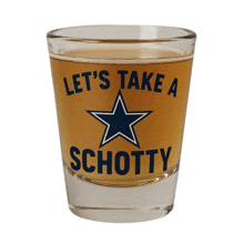 a shot glass with the words let 's take a schotty on it
