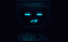 a dark room with a blue screen that says tnt on it