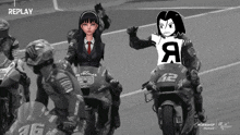 a replay of a motorcycle race with a girl and a man in a petronas shirt