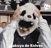a person wearing a panda hat with the words " sakuya de knives " above them