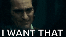 a close up of a man 's face with the words `` i want that '' written below it .