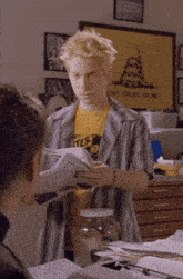 a man wearing a shirt that says ' dont tread on me ' on it