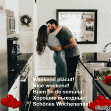 a picture of a man and woman kissing in a kitchen with the caption weekend placut nice weekend buen fin de semana