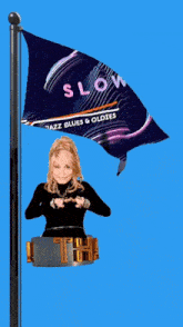 a woman stands in front of a flag that says slow jazz blues & oldies