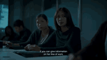 a woman sitting at a desk with the words if you can give information on her line of work