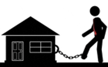 a man is chained to a house with a chain around his leg .