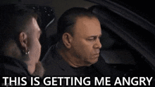 two men are sitting in a car with the words `` this is getting me angry '' written above them .
