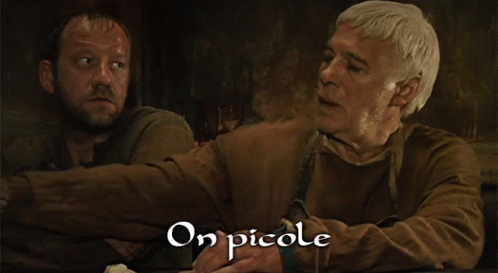 two men sit at a table with the words et on augmente les doses