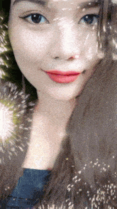 a close up of a woman 's face with a fireworks display in the background