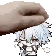 a hand is holding a cartoon character 's head and making a face .