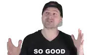 a man wearing a black shirt with the word so good on it