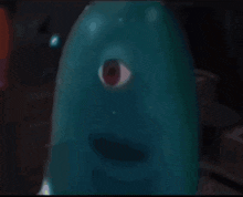 a close up of a cartoon character with one eye
