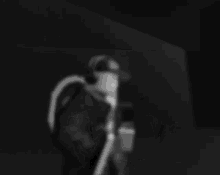 a black and white image of a roblox character wearing headphones and smiling