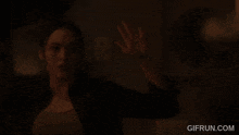 a dark brown background with the website gifrun.com at the bottom .
