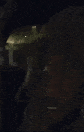 a close up of a man 's face with a flashlight on it .