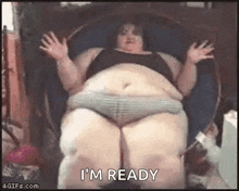 a very fat woman is sitting in a chair with her arms outstretched and says i 'm ready .