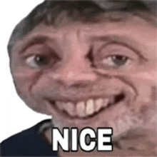 a close up of a man 's face with the word nice on it .