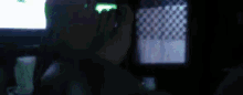 a blurry picture of a man talking on a phone